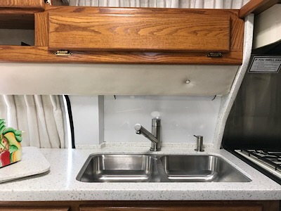 New sink, Corian countertop, pull out faucet &amp; pump soap dispenser.