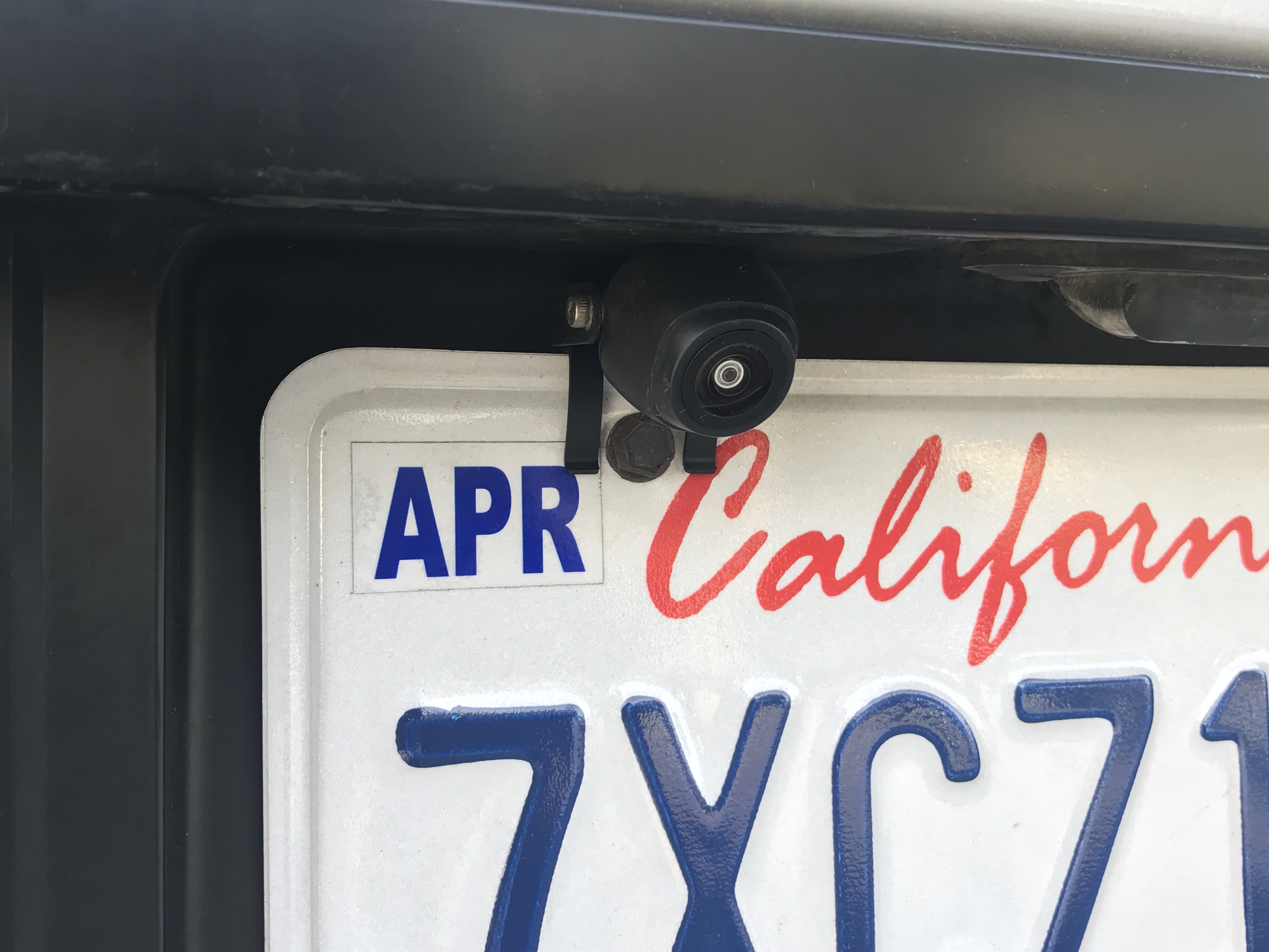 Rear wireless cam bolts to license plate.